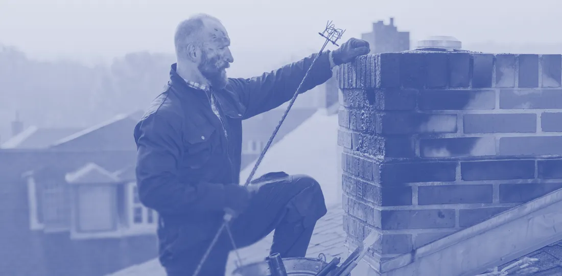 Chimney sweep inspecting flue ducts
