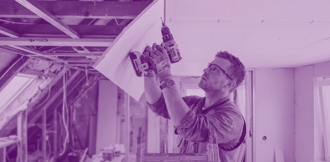 Installer working on drywall gypsum partitions