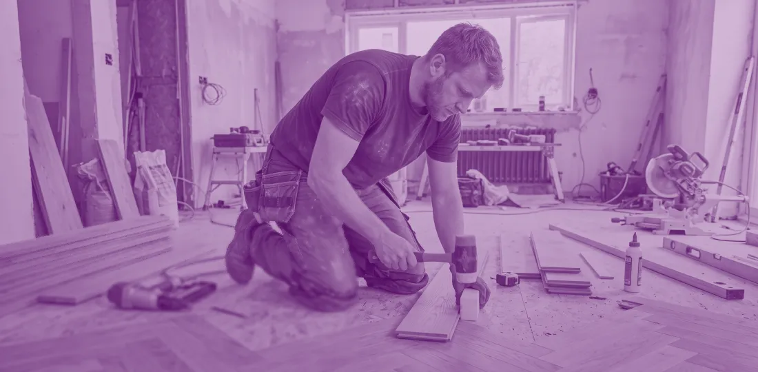 Flooring specialist laying a wooden floor