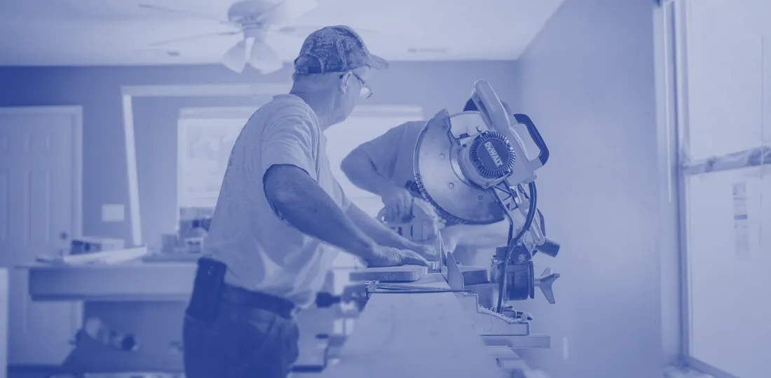 Joiner installing custom furniture at a client site
