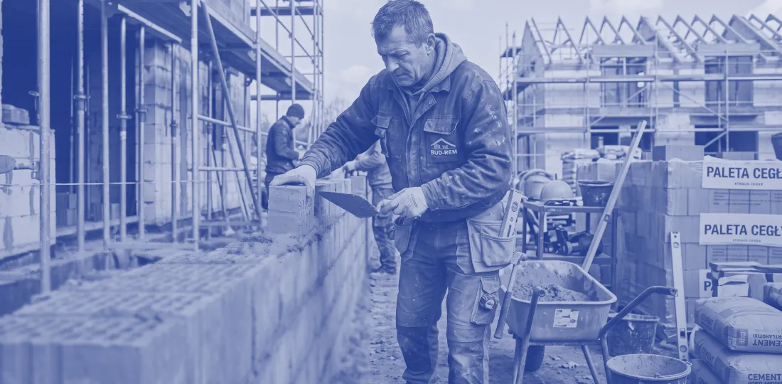 Bricklayer building walls on a construction site